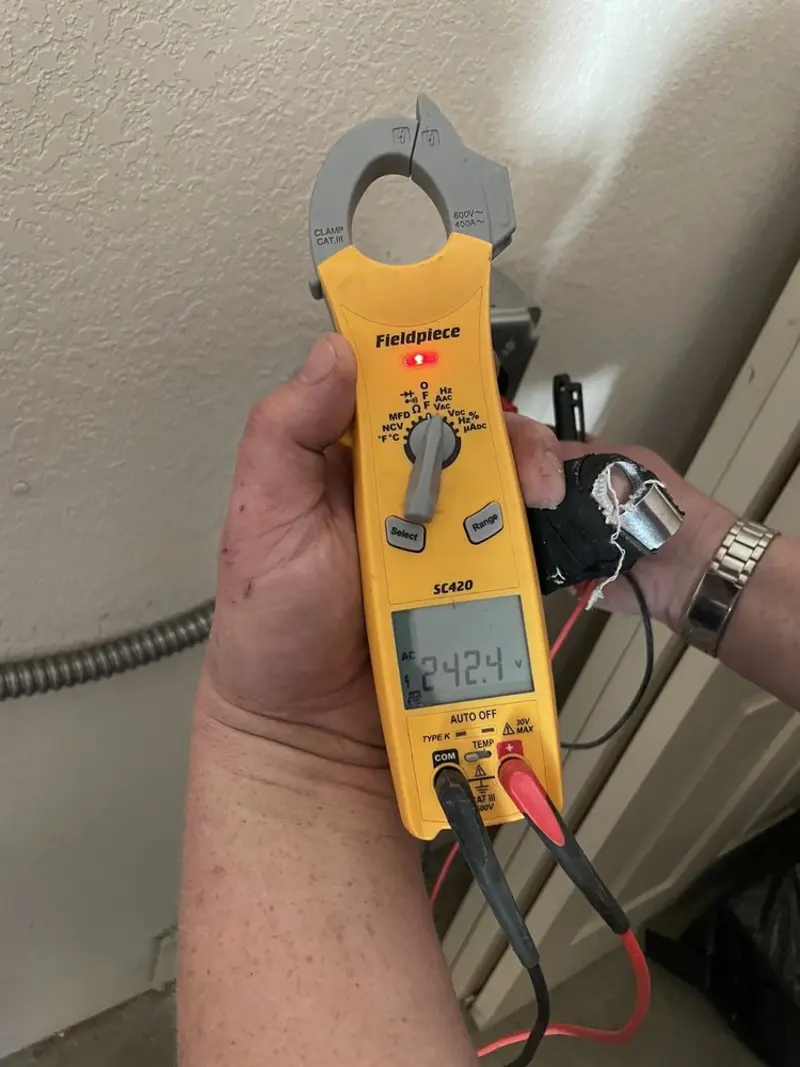 Voltage testing with clamp meter during Recessed Lighting Installation in Malvern
